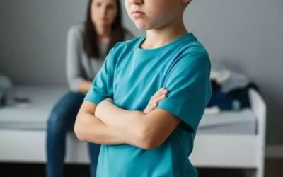 Child with ADHD struggling to focus on homework while parents look concerned, highlighting early attention disorder symptoms and the need for professional support.